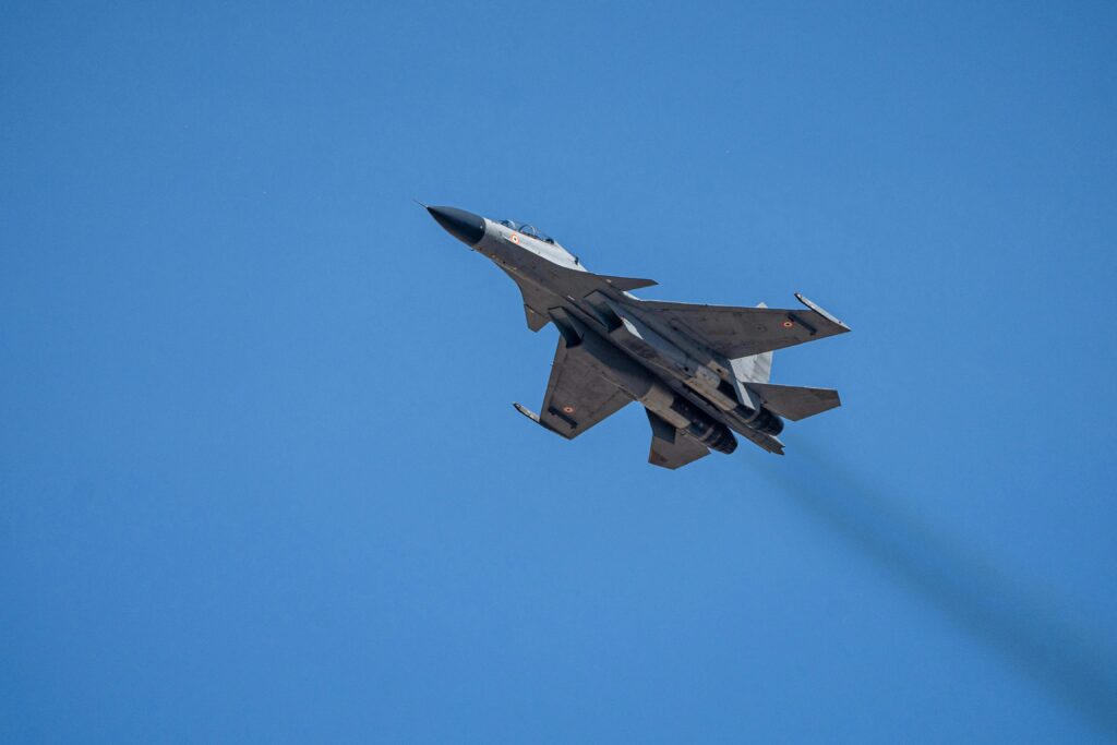 Captivating shot of a Sukhoi jet soaring in the clear blue sky during the Bangalore air show.