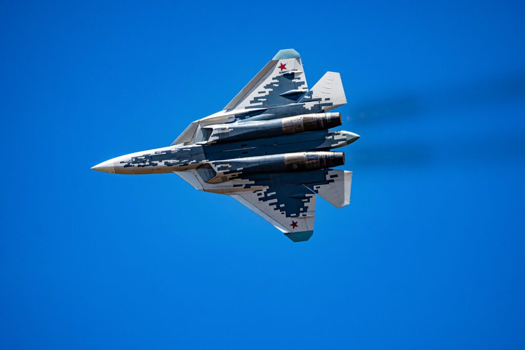 Military jet soaring through the sky, showcasing aviation excellence and speed.
