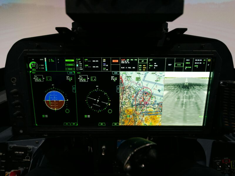 Digital cockpit screen with navigation and flight data for advanced training.